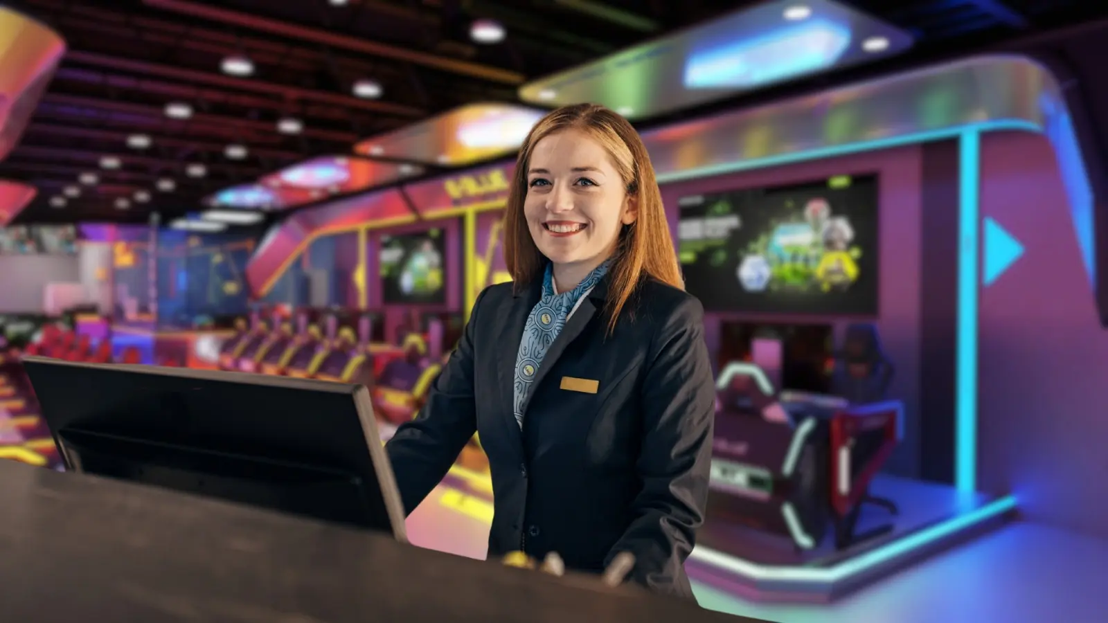 Professional hotel staff member in modern gaming lounge setup
