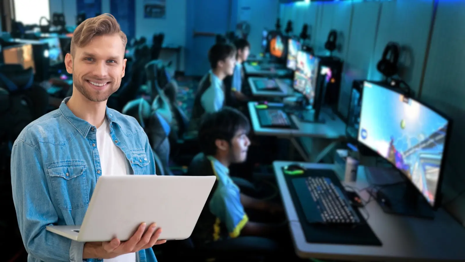 Professional educator with laptop in modern esports training facility for schools