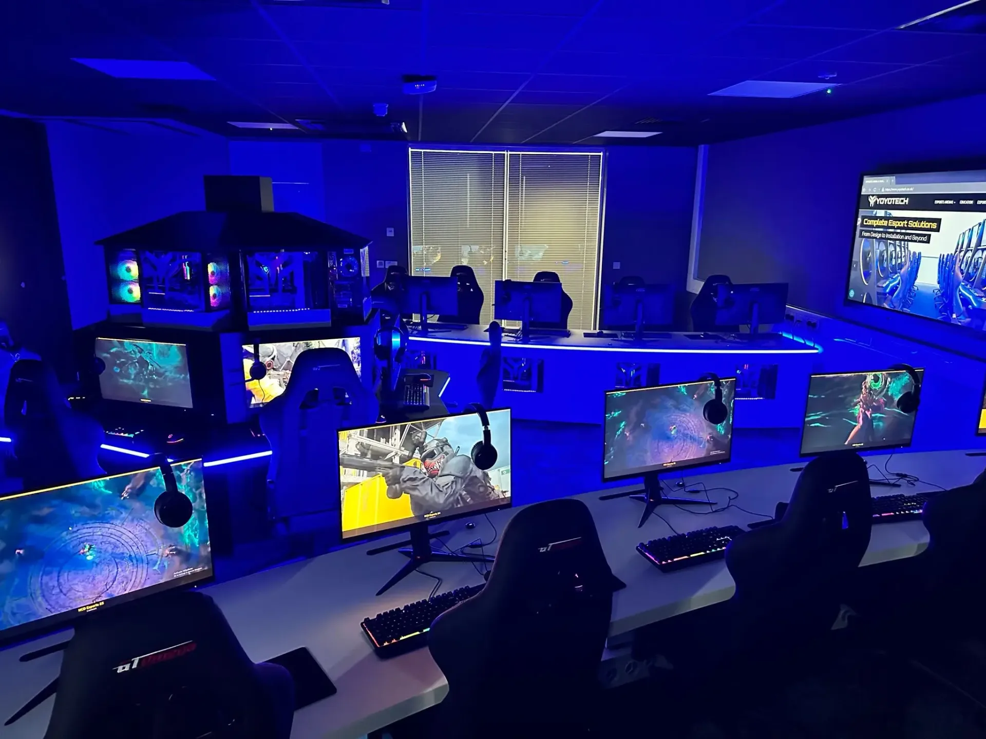 Professional esports facility design with gaming stations and tournament setup