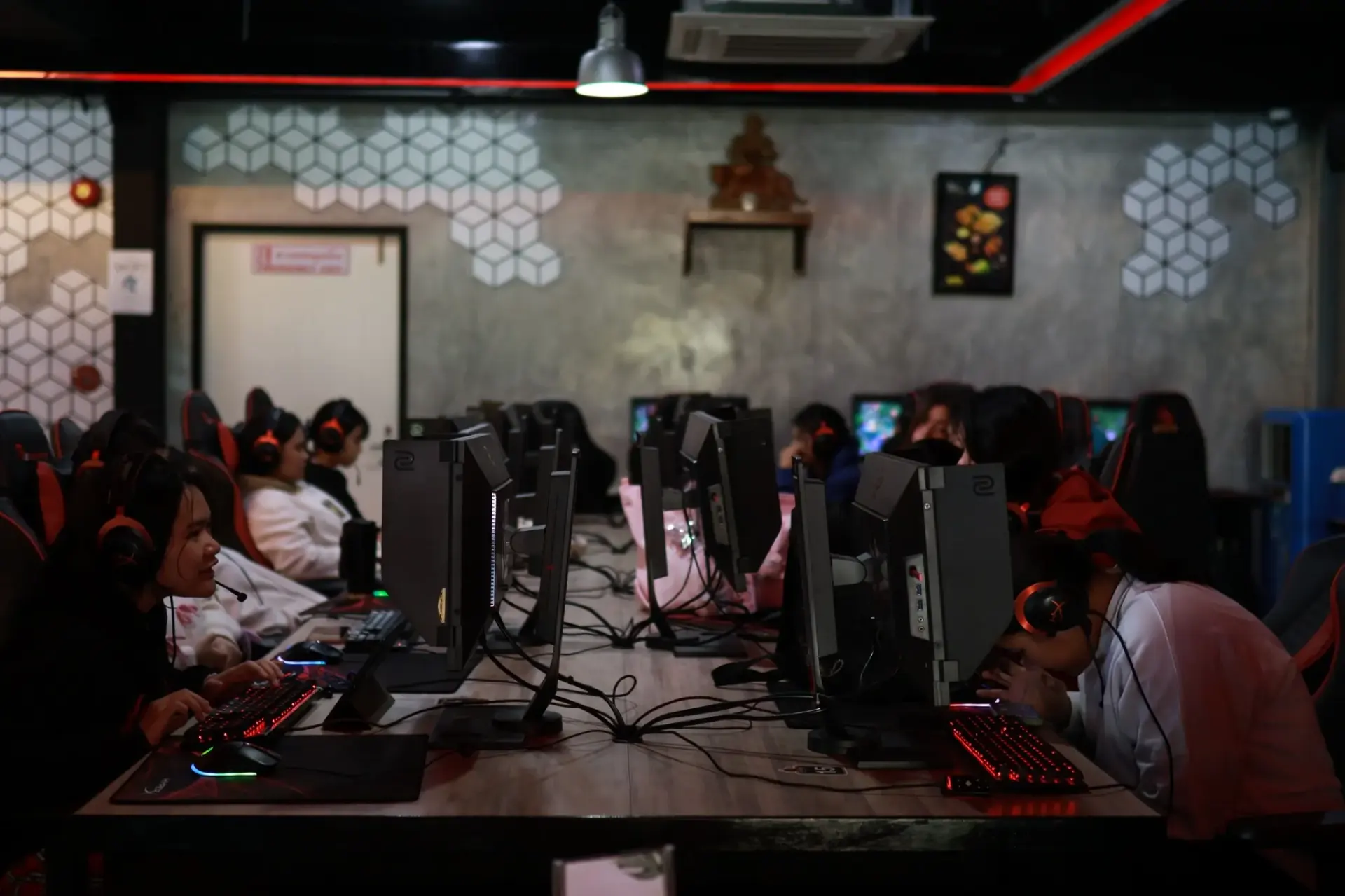 Students in esports gaming room with headsets